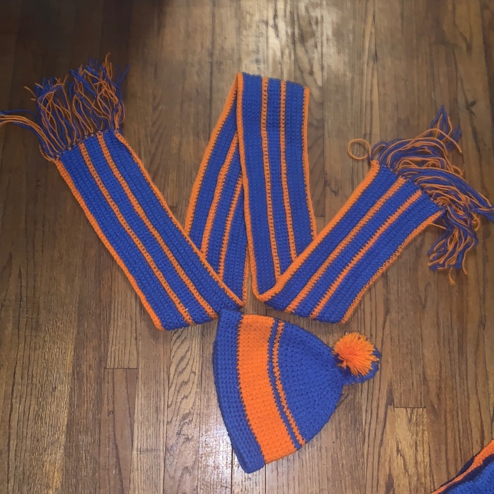 Handmade crocheted blue and orange Pom Pom hat and fringed scarf.